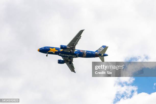 eurowings airlines airbus a320 airplane flying in mid air - a320 turbine engine stock pictures, royalty-free photos & images