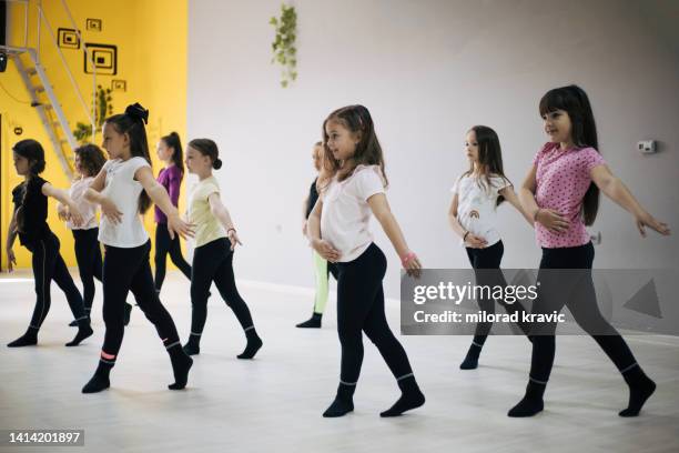 children practicing in dancing in studio. - show girl stock pictures, royalty-free photos & images