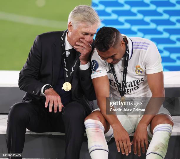 Carlo Ancelotti, Head Coach of Real Madrid, chats with Casemiro after the UEFA Super Cup Final 2022 between Real Madrid CF and Eintracht Frankfurt at...