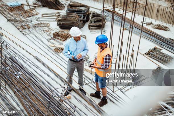 construction industry and engineering - engineers, architects and contractors on the construction site - property developer stock pictures, royalty-free photos & images