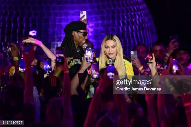 Nile Rodgers and Madonna speak to a crowd at The DiscOasis in Central Park on August 10, 2022 in New York City.