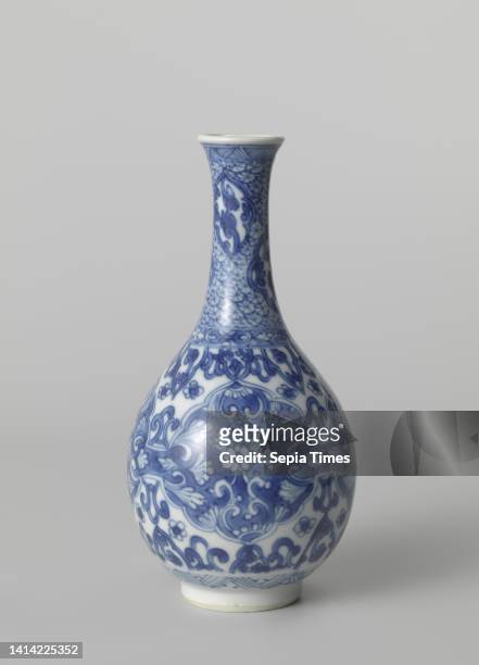 Pear-shaped bottle vase with floral scrolls, Bottle-shaped vase of porcelain with a pear-shaped body and spreading neck, painted in underglaze blue....