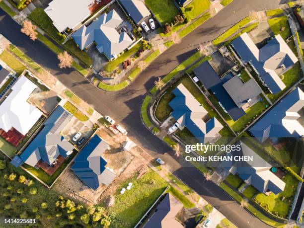 areal shoot of city suburban area and houses - house golden hour stock pictures, royalty-free photos & images