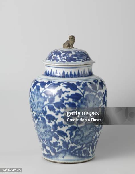 Ovoid covered jar with large peonies, Baluster shaped lidded jar of porcelain with a wide neck, painted in underglaze blue. On the wall four large...