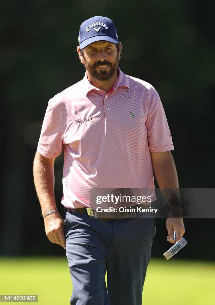 Thomas Aiken of South Africa chips onto the 18th green during the first round of the ISPS Handa World Invitational presented by AVIV Clinics at...