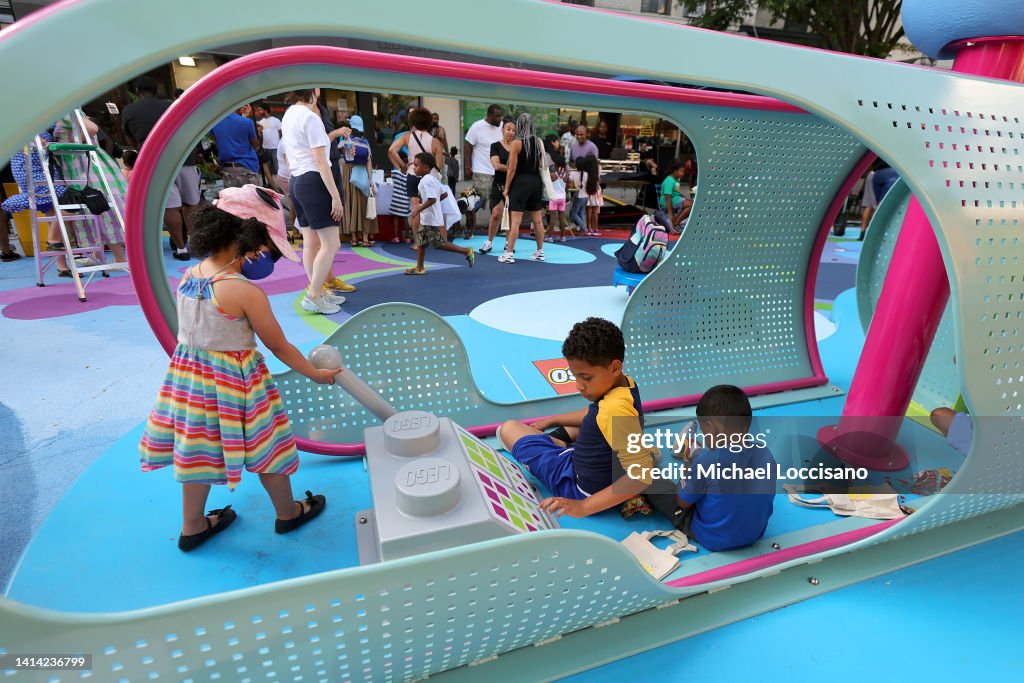 Children and families play as The LEGO Group, Hebru Brantley, and The