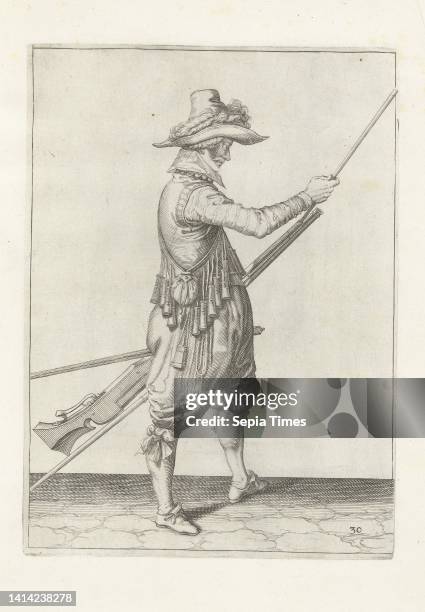 Soldier sliding his ramrod into the holder under the barrel of his musket , c. 1600, A soldier, full-length, to the right, holding a musket with his...