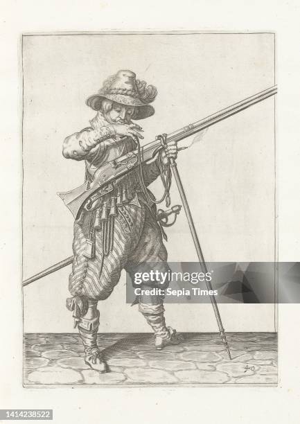 Soldier on guard with a musket bringing its fuse to his mouth to blow it clean , c. 1600, A soldier on guard, full-length, to the right, holding a...