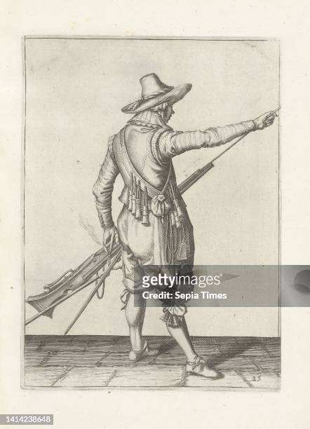 Soldier removing his ramrod from the holder under the barrel of his musket , c. 1600, A soldier, full-length, to the right, seen from behind, holding...