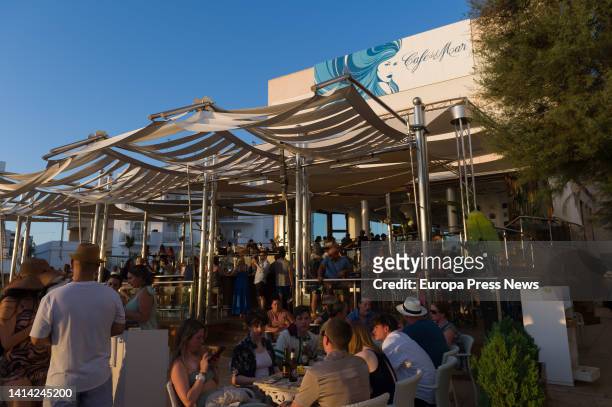 Diners enjoy themselves at Cafe del Mar, on 10 August, 2022 in Ibiza, Balearic Islands, Spain. Cafe del Mar opened in 1980 with the idea of becoming...