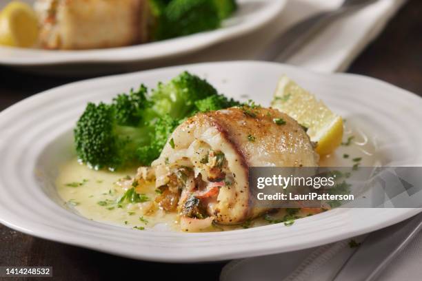 creamy crab stuffed tilapia - cod dinner stock pictures, royalty-free photos & images