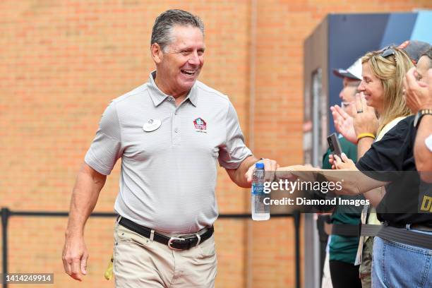 Hall of Fame wide receiver Steve Largent celebrates with fans as he is introduced prior to the Pro Football Hall of Fame Enshrinement on August 06,...