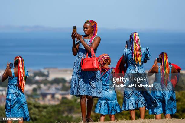 Rwandan woman drummers perform during the photocall for "The Book of Life" at the Edinburgh International Festival on August 11, 2022 in Edinburgh,...