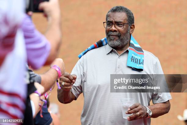 Hall of Fame defensive tackle Joe Greene celebrates with fans as he is introduced prior to the Pro Football Hall of Fame Enshrinement on August 06,...