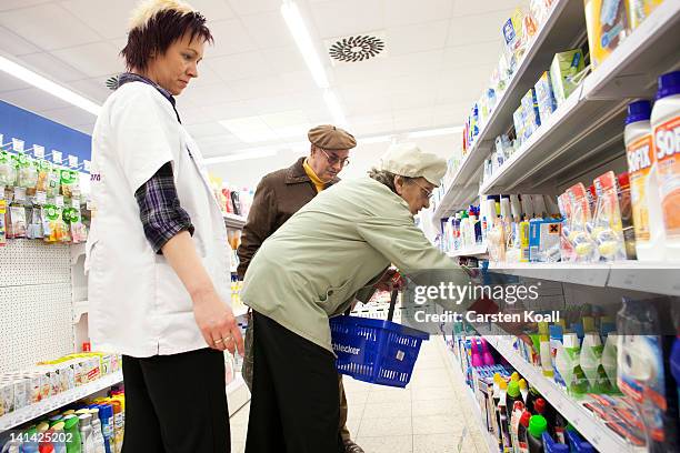 Branch manager advises customers at a Schlecker drugstore on March 16, 2012 in Strausberg, Germany. The German drugstore chain released a list of...