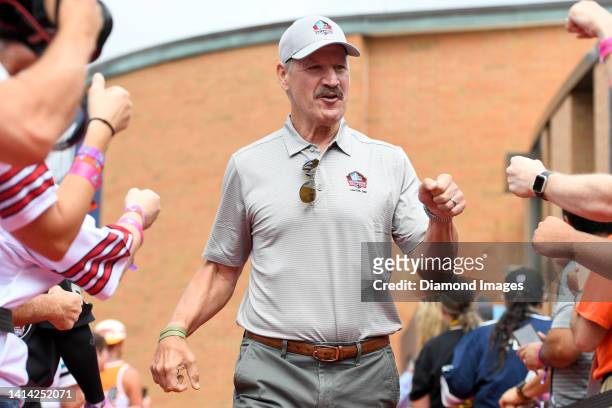 Hall of Fame head coach Bill Cowher celebrates with fans as he is introduced prior to the Pro Football Hall of Fame Enshrinement on August 06, 2022...