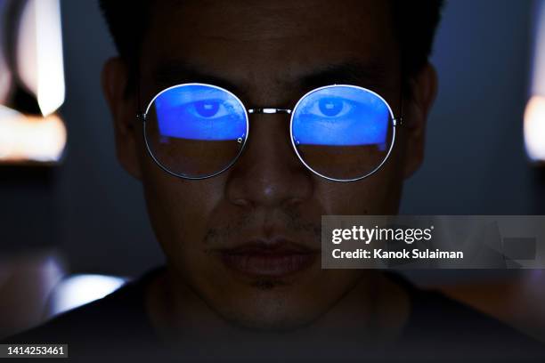 computer hacker stealing information with computer - asian violence stock pictures, royalty-free photos & images