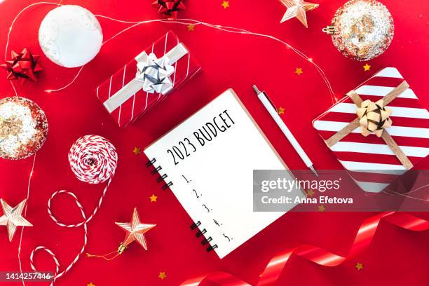 writing budget for 2023 year. new year coming concept. - christmas budget stock pictures, royalty-free photos & images