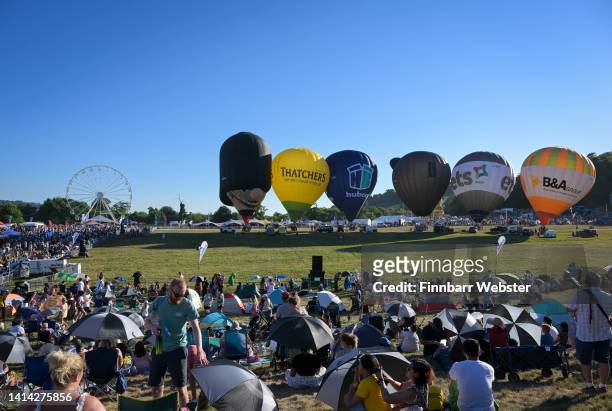 Balloons are inflated for the crowd at Bristol International Balloon Fiesta at Ashton Court Estate, on August 11, 2022 in Bristol, England. From the...