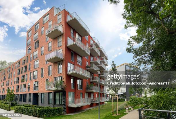 cityscape of a residential area with modern apartment buildings, new green urban landscape in the city - casa popolare foto e immagini stock