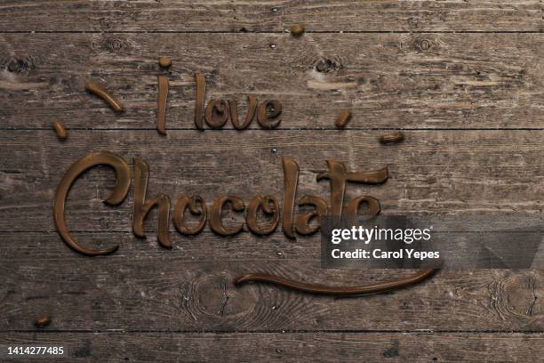 top view written i love chocolate word in wooden background - chocolate top view imagens e fotografias de stock