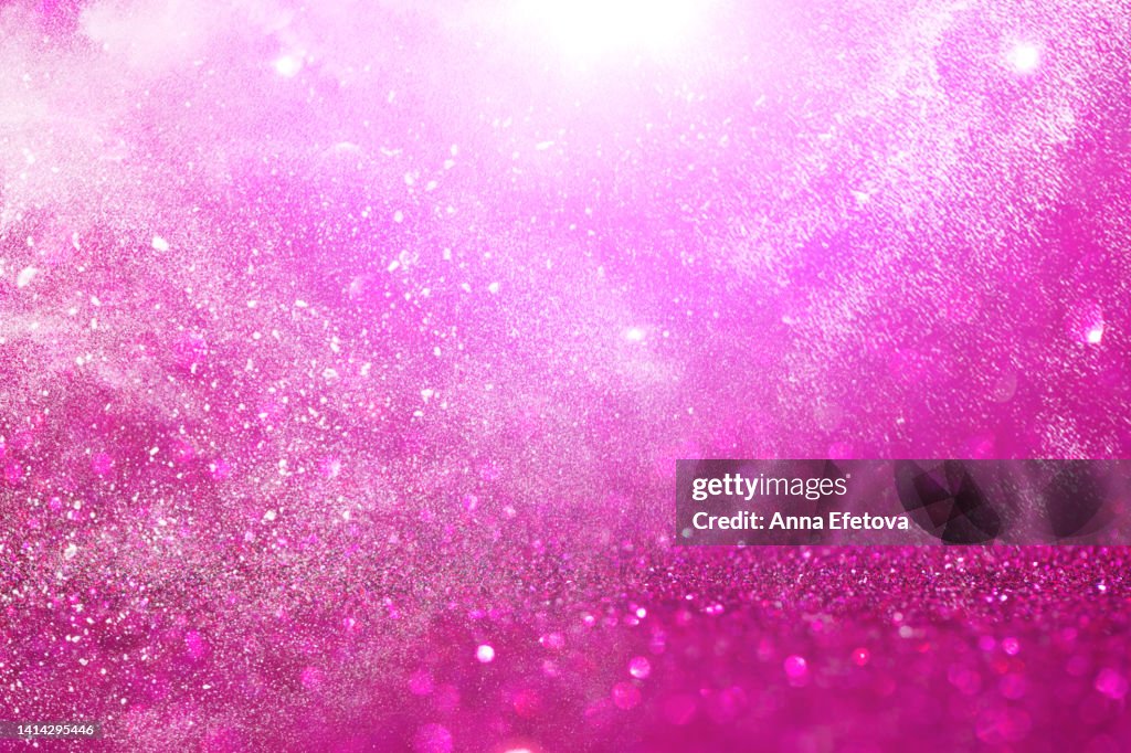 Pink background made of sequins. Holiday concept. Copy space for your design. Flat lay style