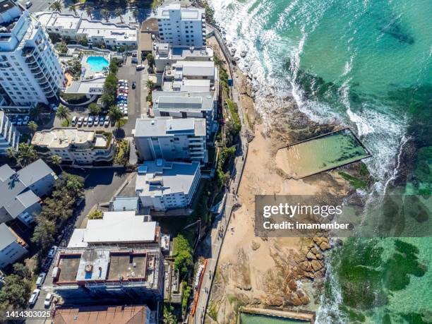 aerial view of beautiful coastal town with ocean swimming pool, background with copy space - town australia bildbanksfoton och bilder