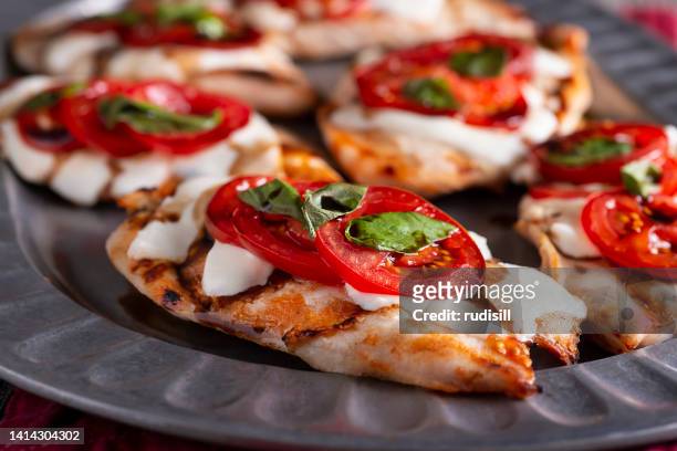 grilled caprese chicken - caprese salad stock pictures, royalty-free photos & images