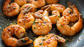 Closeup garlic butter shrimp in pan