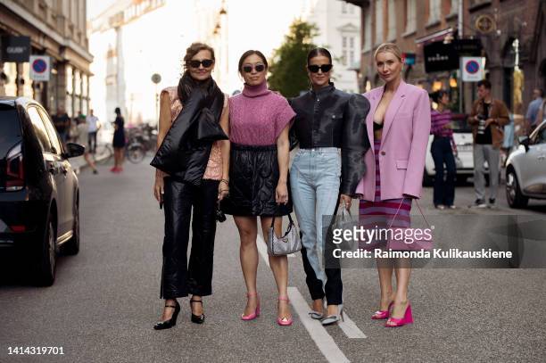 Guests posing outside Baum und Pferdgarten during Copenhagen fashion week Spring / Summer 2023 on August 10, 2022 in Copenhagen, Denmark.