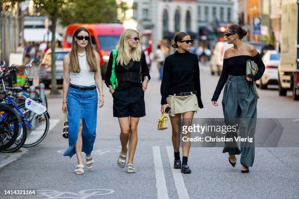 Guests seen outside Baum & Pferdgarten during Copenhagen Fashion Week Spring/Summer 2023 on August 10, 2022 in Copenhagen, Denmark.