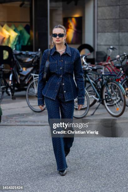 Emilie Billington seen wearing denim navy jacket, flared pants outside Baum & Pferdgarten during Copenhagen Fashion Week Spring/Summer 2023 on August...