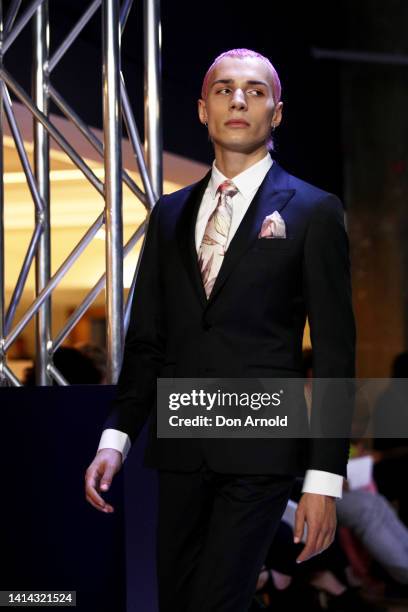 Nathan Angelis showcases designs on the runway during the David Jones SS22 Launch at David Jones Elizabeth Street Store on August 10, 2022 in Sydney,...