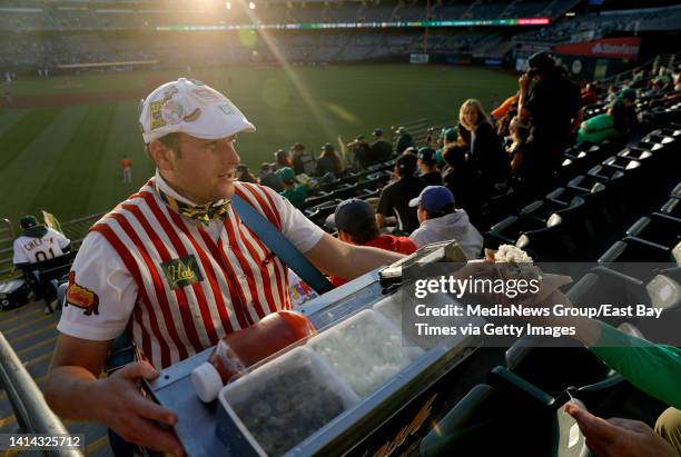 Hal Hal the Hot Dog Guy Gordon sells hot dogs in the right field bleachers during the Oakland Athletics game against the Houston Astros at the...