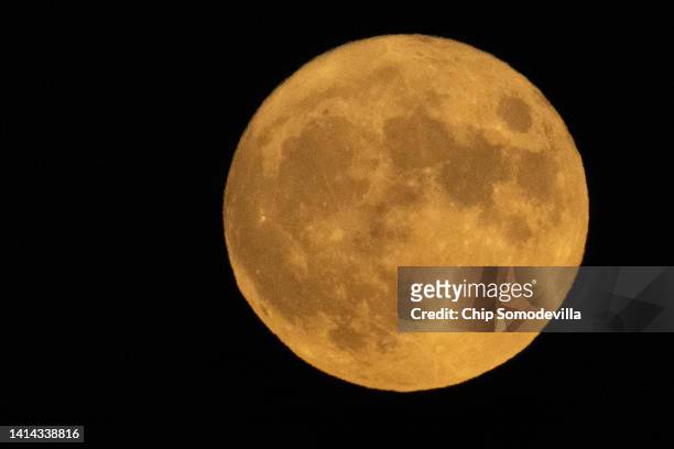 The moon rises on August 11, 2022 in Washington, DC. The so-called Sturgeon Moon is the fourth and final super moon of 2022.