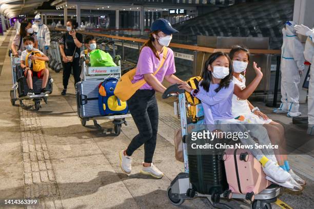 Tourists prepare to board their flight at the Haikou Meilan International Airport on August 11, 2022 in Haikou, Hainan Province of China. The first...