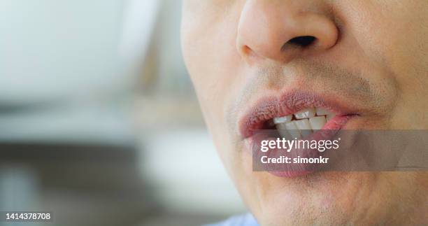 lips of mature man - mouth talking stock pictures, royalty-free photos & images