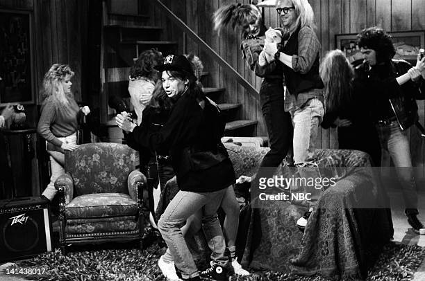 Episode 16 -- Pictured: Mike Myers as Wayne Campbell, Jan Hooks as Nancy Simmons, Dana Carvey as Garth Algar during the 'Wayne's World' skit on March...