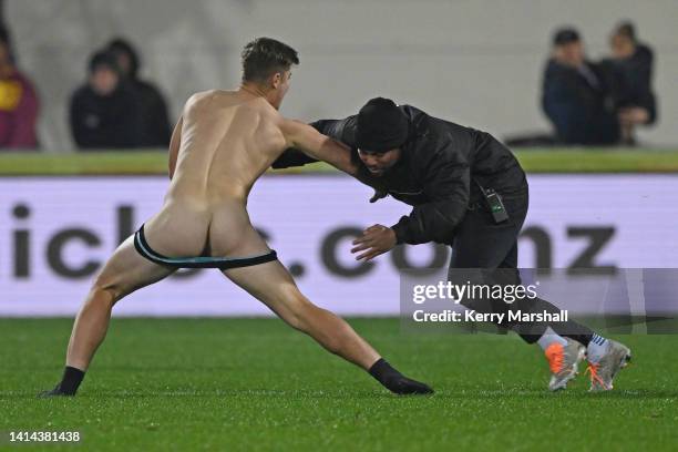 Streaker is tackled during the round two Bunnings NPC match between Hawke's Bay and Counties Manukau at McLean Park, on August 12 in Napier, New...