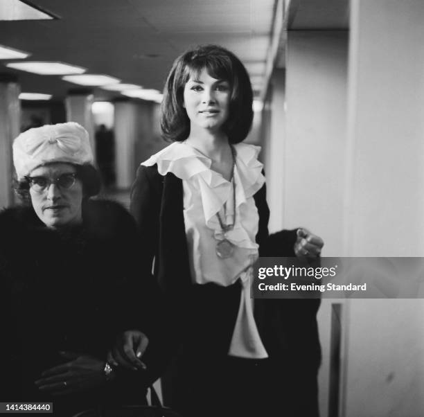 British fashion model and actress April Ashley with her mother, Ada Jamieson, at London Airport in London, England, 11th May 1962. The Sunday People...