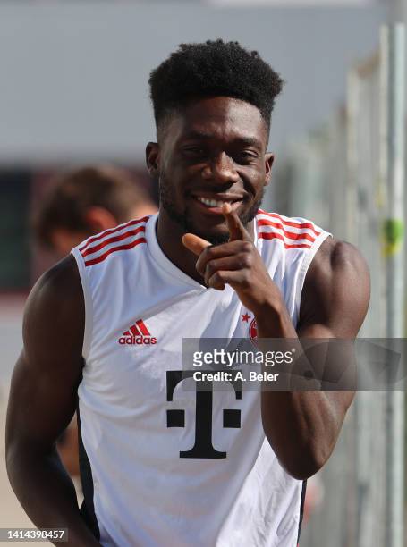 Alphonso Davies of FC Bayern Muenchen poses as he arrives for a training session of FC Bayern München at Saebener Strasse training ground on August...