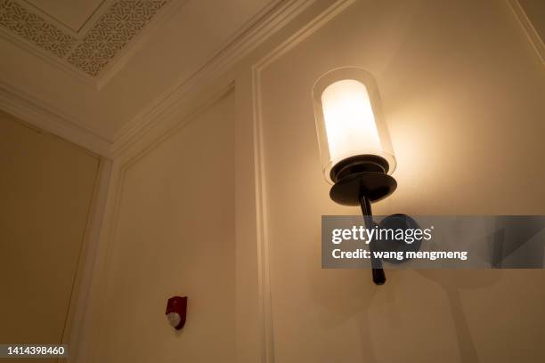 wall lamp indoors - sconce stock pictures, royalty-free photos & images