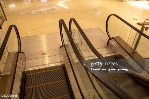 lower end of escalator - trapezoid stock pictures, royalty-free photos & images