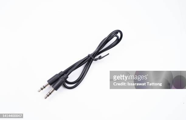 black 3.5 mm. jack audio cable on white background. - network connection plug stock pictures, royalty-free photos & images