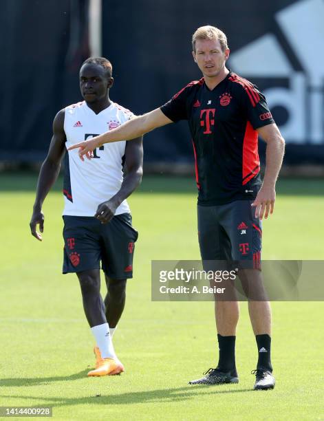 Team coach Julian Nagelsmann of FC Bayern Muenchen gestures next to Sadio Mane during a training session of FC Bayern München at Saebener Strasse...