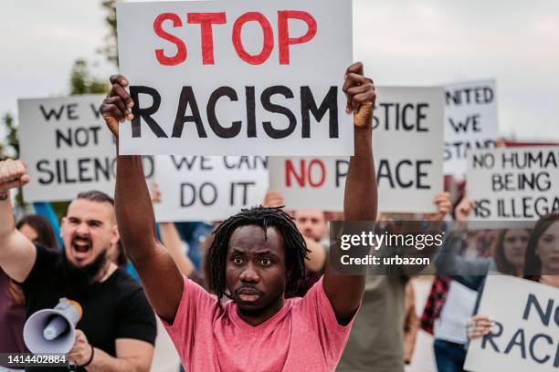 people protesting against racism - black lives matter stock pictures, royalty-free photos & images