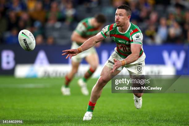 Damien Cook of the Rabbitohs offloads the ball during the round 22 NRL match between the Parramatta Eels and the South Sydney Rabbitohs at CommBank...