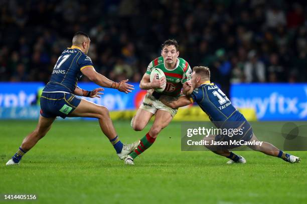 Cameron Murray of the Rabbitohs is tackled during the round 22 NRL match between the Parramatta Eels and the South Sydney Rabbitohs at CommBank...