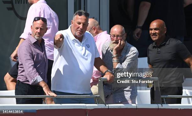 Former Durham players Simon Hughes Lord Ian Botham and Graeme Fowler and Ash Patel watch from the balcony during a former Durham players reunion...