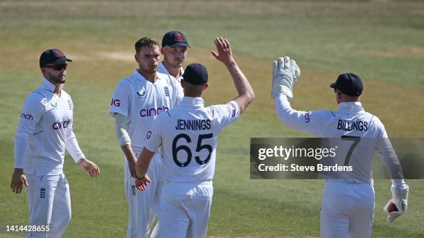 Sam Conners of England Lions celebrates taking the wicket of Keshav Maharaj of South Africa caught by Sam Billings with his team mates during day...